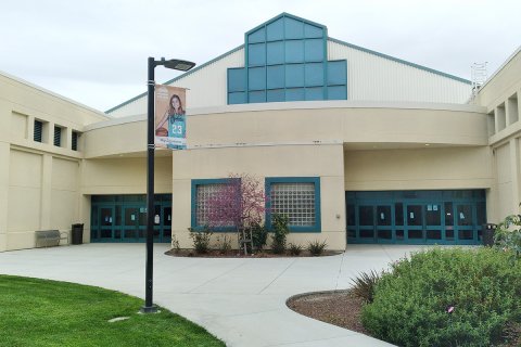 front of the gym with blue windows in a pyramid shape